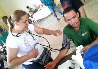 Dr. Luz administering treatment