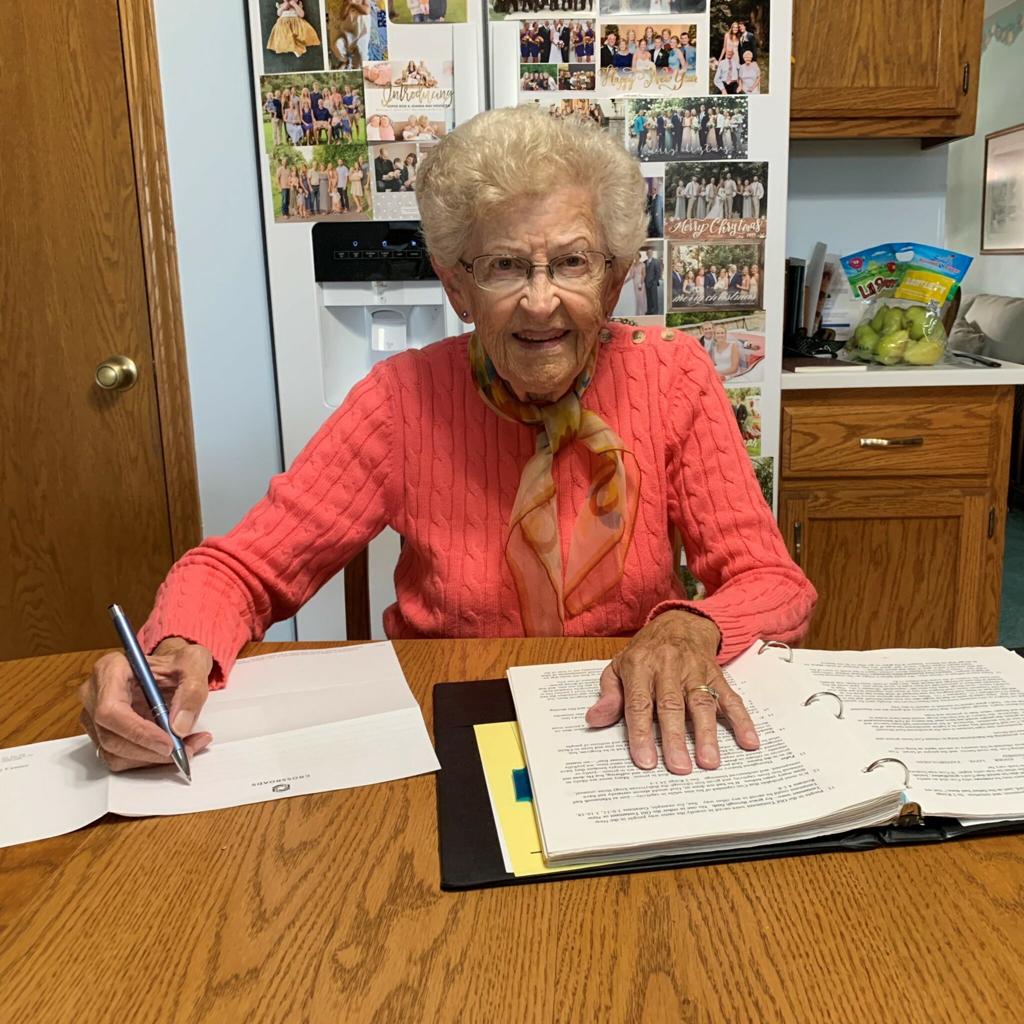 Grace responds to a student’s lesson at her kitchen table in Illinois.