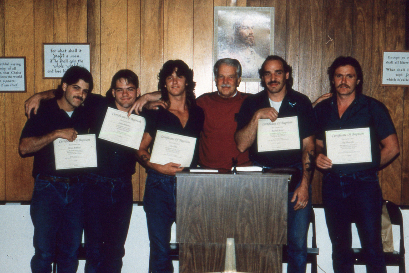 In the early days, Crossroads collaborated with the ministry now known as Reach the Forgotten to minister to Kent County Honor Camp participants at the Kent County Jail. Students pose with volunteer Andy VanderWall.